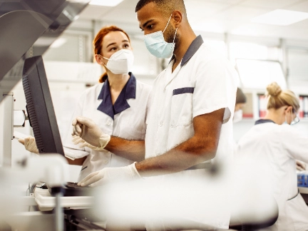Laboratory workers discussing results 