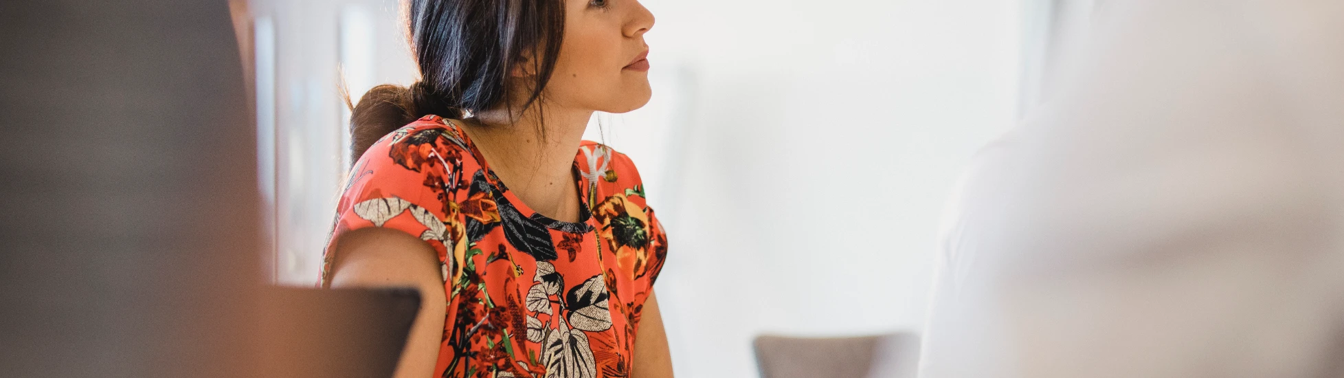 Young office worker wearing an orange blouse