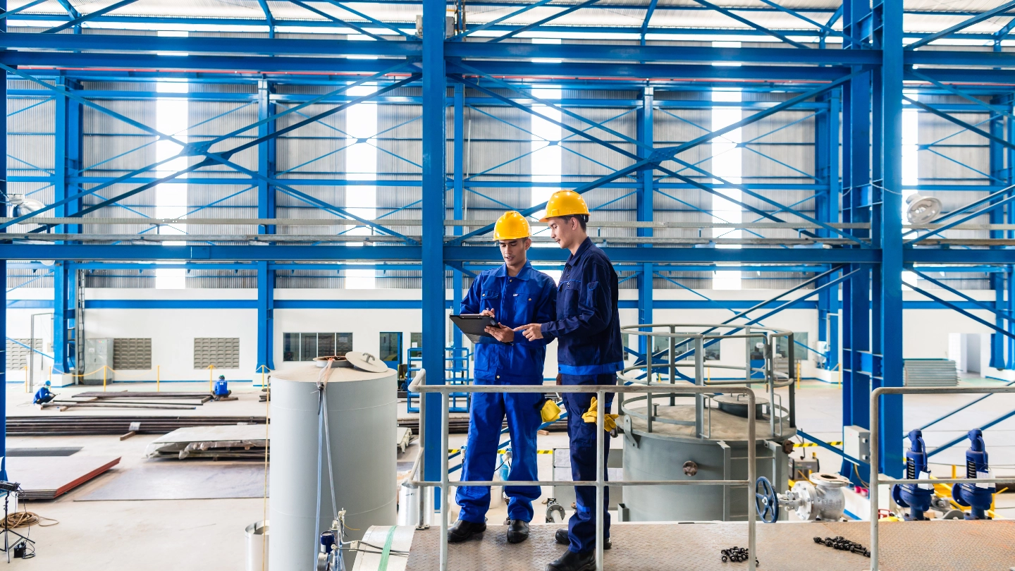 Two workers in factory image