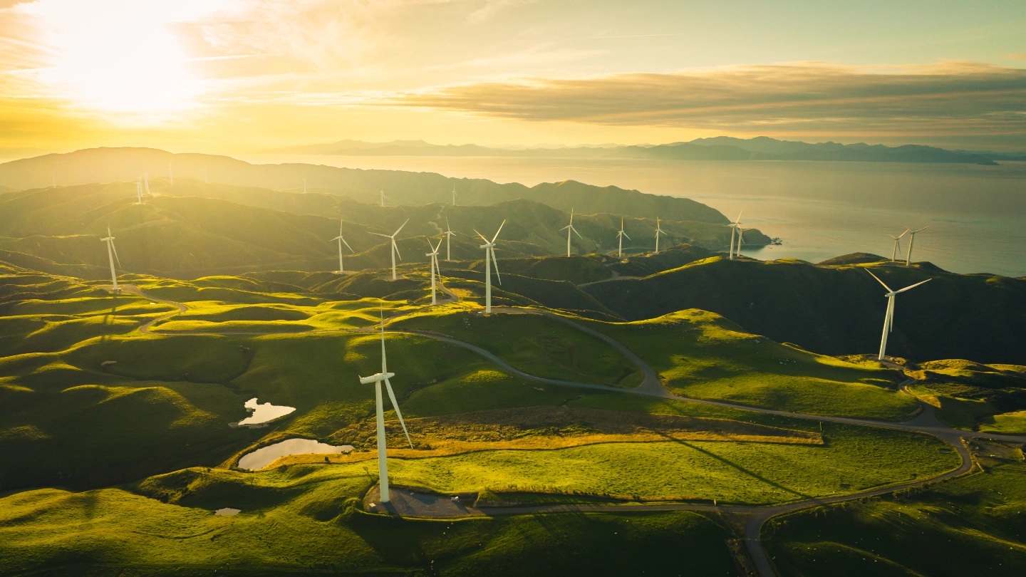 Collection of wind turbines on rolling hillside Collection of wind turbines on rolling hillside